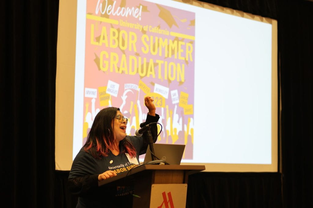 woman at podium speaking at labor summer graduation