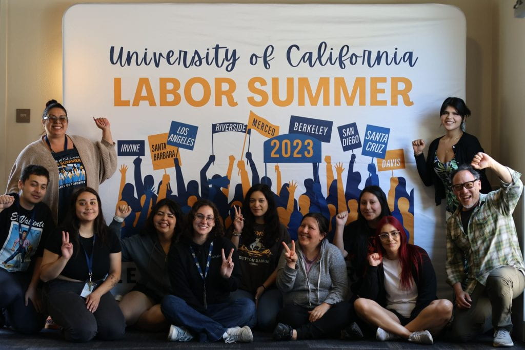 students in front of labor summer sign
